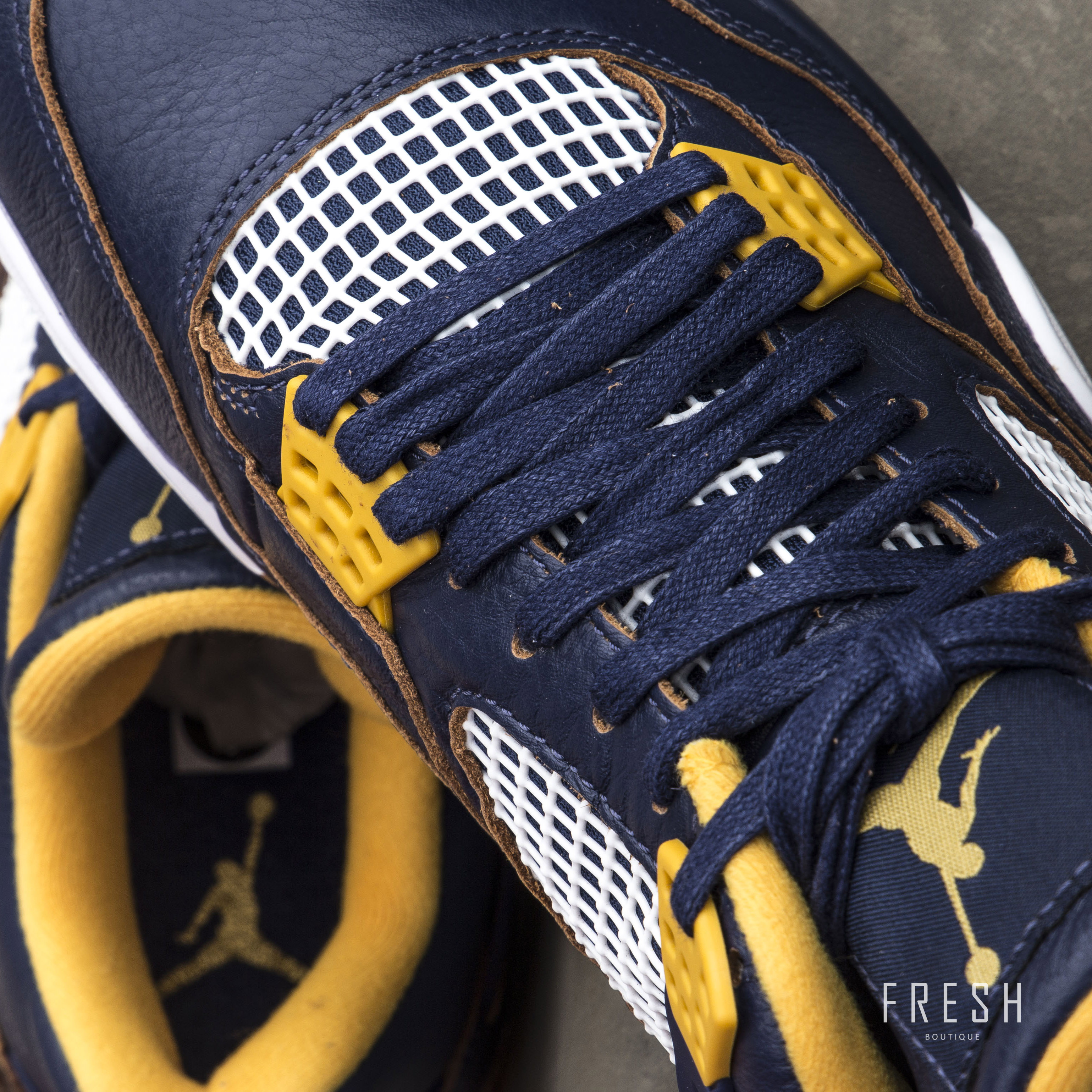 navy blue and gold tennis shoes